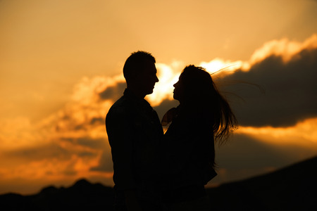 Kissing couple silhouette in the sunset sky. Allways together forever and Love concept. Feeling in...