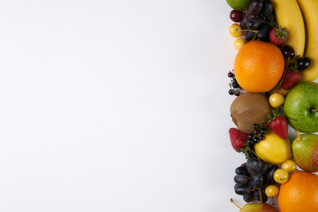 Collection fruits and vegetables isolated on white background with copy space. Detox and healthy food concept. Vegetarian food.の写真素材