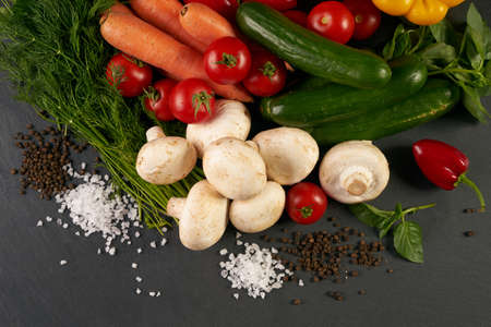 Close-up of a fresh delicious ingredients for healthy cooking or salad making on rustic background,...