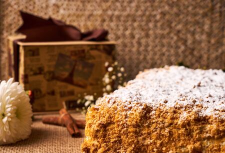 Homemade Napoleon cake. Layered puff pastry napoleon cake with powdered sugar and butterscotch...