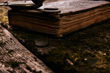 Pocket watch with an old antique bible book and ancient copper cの写真素材