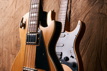 Wooden electric bass guitar and classic electric guitarの写真素材