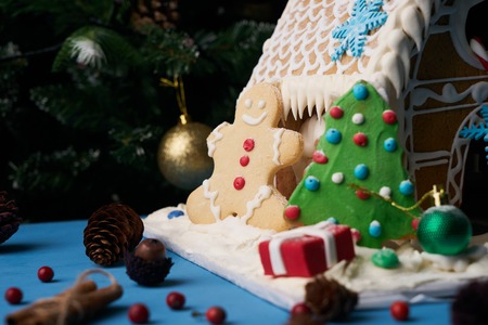 Gingerbread house with Christmas treesの写真素材