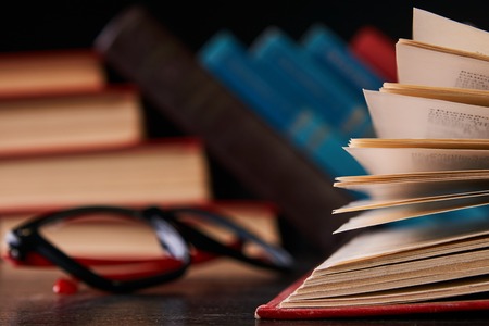 Books with books and glassesの写真素材