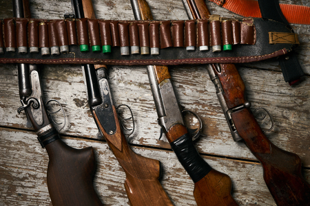 Hunting rifles with leather bandolier with ammunition