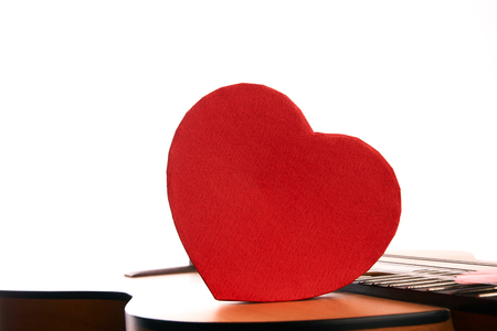 Acoustic Guitar with red heartsの写真素材