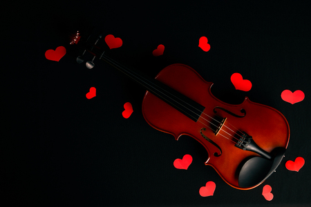 Valentines Day concept with violin and red heartsの写真素材
