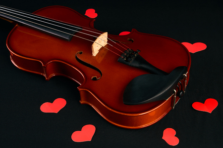 Valentines Day concept with violin and red heartsの写真素材