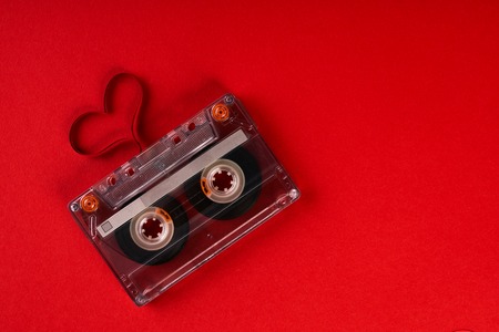 Audio cassette with magnetic tape in shape of heartの写真素材