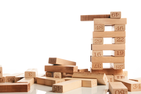 Blocks of wood isolated on white background with copy space. Wooden blocks tower, strategy game as a business plan for team workの写真素材
