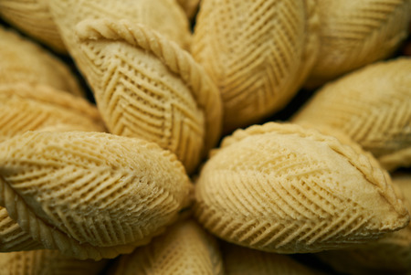 Novruz tray with traditional Azerbaijan pastries shekerbura on wooden table background, top viewの写真素材