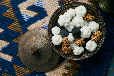 Azerbaijan national candies white nogul in silver bowl, snack for tea. Close-up top viewの写真素材