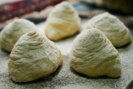 Novruz tray with Azerbaijan traditional pastry cookie Badambura on wooden rustic table background. Dessert for the Azerbaijani national holiday Novruz Bayramの写真素材