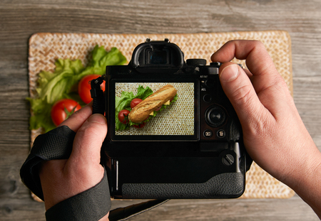 Taking photo of subway sandwich with cameraの写真素材