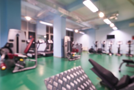 Blurred of fitness gym for fitness workout with sport equipment, background for banner presentation.の写真素材