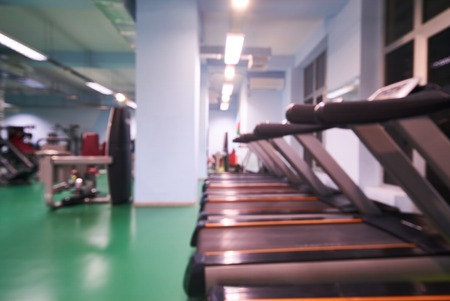 Blurred of fitness gym for fitness workout with sport equipment, background for banner presentation.の写真素材