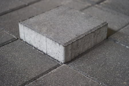 Concrete road curbs at the factory for the production of cement products, paving slabsの写真素材