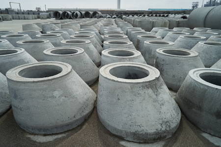 Stacked pipe at concrete factory. Large Concrete Construction Pipes for Underground Waterの写真素材