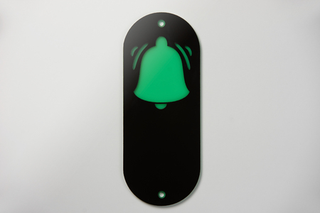 Emergency call button on a white background, close-up