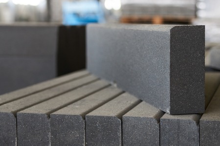 Concrete sidewalk square tiles. Lawn tile in cement factory.