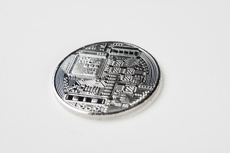 Silver bitcoin circuit texture isolated on white background. Cryptocurrency coin, close-upの写真素材