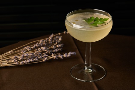 Petrucho cocktail drink on bar table in restaurant. Freshness drink with Parsley Infused, Cacao...