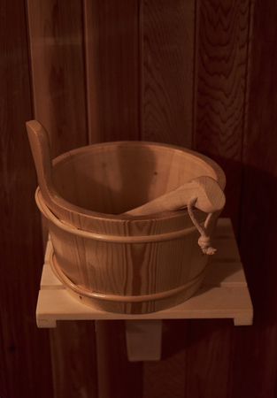 Wooden basin with scoop in the bath house on the shelfの写真素材