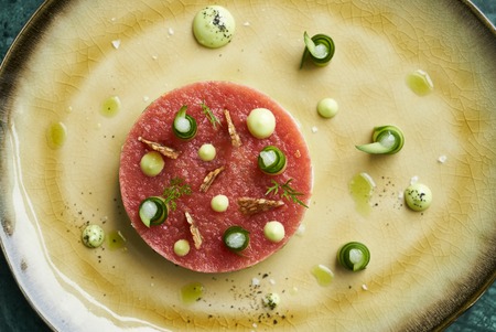 Salad with wild shrimps, young cabbage, tomato fillet and citronet sauce, close-upの写真素材