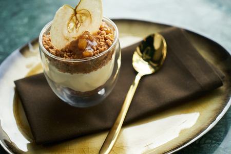 New york cheese cake dessert with mousse with apple cream, caramel, muskovado, close-up. Healthy breakfast foodの写真素材