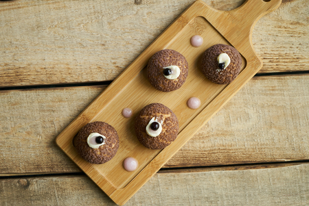 Cake Brioche shu cream chantilly, eclair. Sweet breakfast dessert. White chocolate profiteroles with peach violet.の写真素材