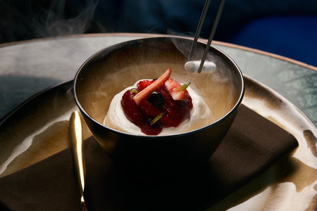 Ice cream with fresh strawberries, marshmallow, currants and mint leaf . Estonian sweet dessert Kama with yoghurt mousse, wild berries and meringuesの写真素材