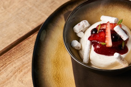 Ice cream dessert with fresh strawberries, marshmallow, currants and mint leaf .の写真素材
