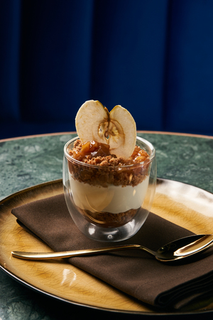 New york cheese cake with mousse with apple cream, caramel, muskovado, close-up. Healthy dessert breakfast foodの写真素材