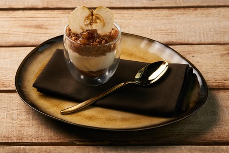 Tasty New york cheese cake with mousse with apple cream, caramel, muskovado, close-up. Healthy dessert breakfast foodの写真素材