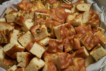 Baked olives bread food in basket, close-up.の写真素材