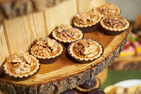 Sweet tartlet snack with walnut and honey, close-up.の写真素材