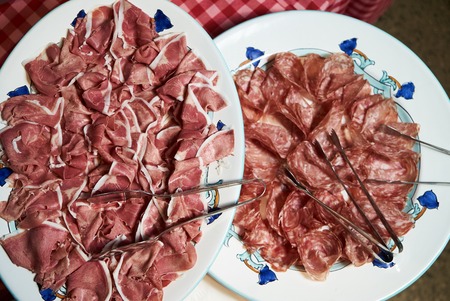 Food tray with sliced ham meat and cheese top view.