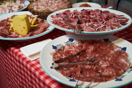 Food tray with sliced ham meat and cheese top view.