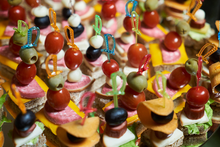 Healthy food tray  with catering wedding buffet table with canape, close-upの写真素材