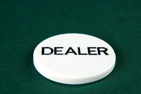 Casino dealer chip on greenの写真素材