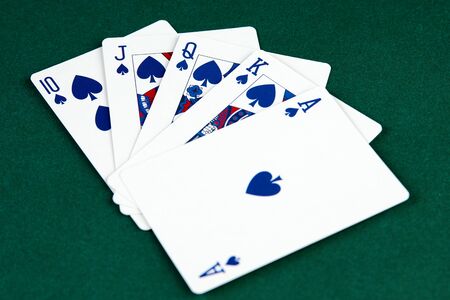 Poker cards on green  with copy space.