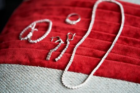 Bride Wedding accessories. Bride wedding set with shoes and engagement rings, close-up.の写真素材