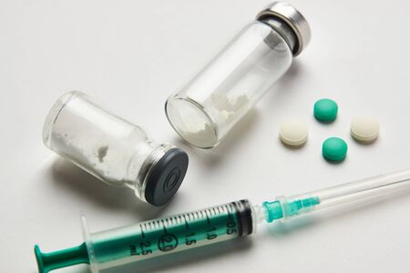 Medical ampoules, infusion and syringe injection on whiteの写真素材