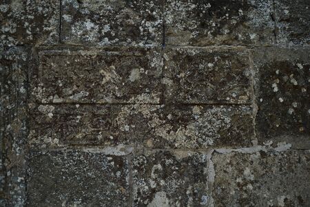 Old rock stone texture background, close-up. Ancient brick stone wall. の写真素材