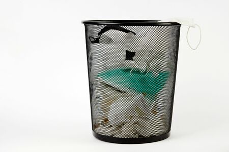 Used medical masks in waste trash bin.の写真素材