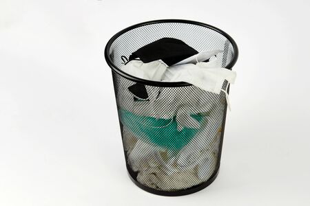 Used medical masks in waste trash bin.