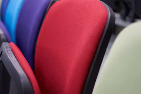 Empty stadium seats, close-up. Colorful seats at the stadium. Rows of the soft chairs in auditorium roomの写真素材