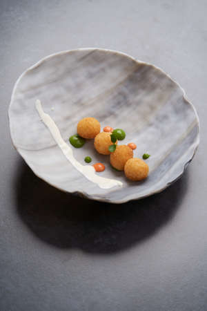 Rice balls on plate. Gluten Free Arancini. Stuffed meatballs arancini with sauce - traditional...