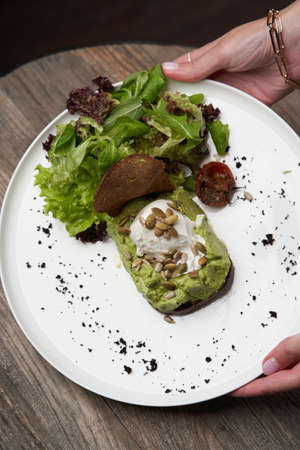 Healthy breakfast table with Crepes, blueberries, strawberry and yoghurt. Pancakes with fresh berries and jamの写真素材