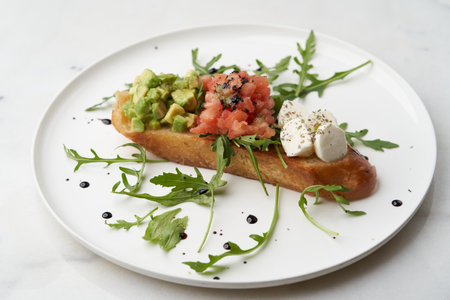Healthy vegetarian bruschetta with vegetable and cheese. Vegetarian sandwiches on white plate on...